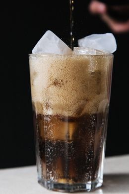Iced cola poured into a tall glass, photo by Ron Lach on Pexels
