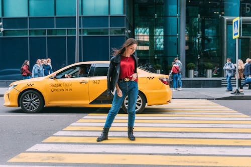 A Woman Posing on the Pedestrian Lane 