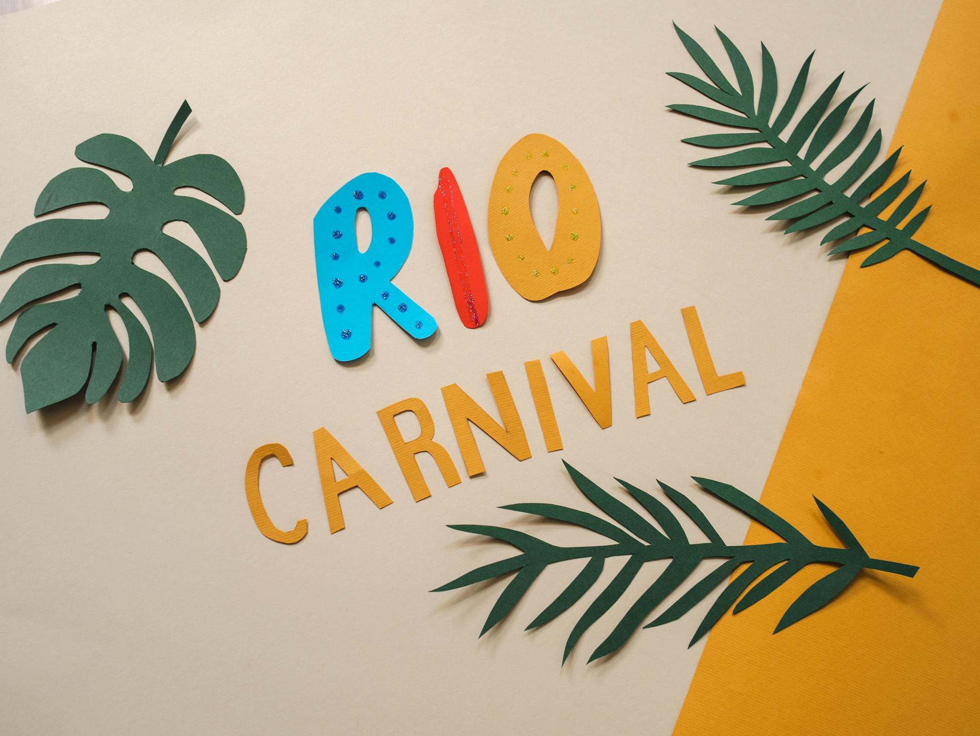 Creative paper art showcasing Rio Carnival with vibrant colors and tropical leaf decorations.