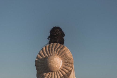 Free Woman with Hat on her Back Stock Photo