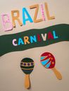 Paper Cutouts of Letters and Maracas Figure