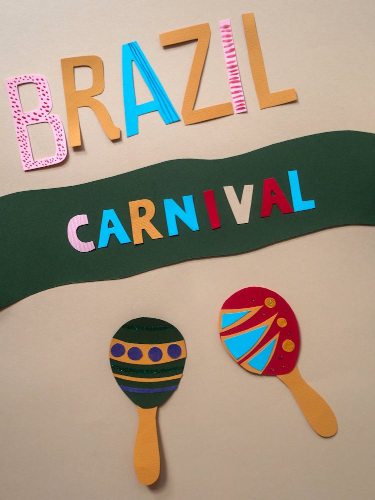 Paper Cutouts Of Letters And Maracas Figure