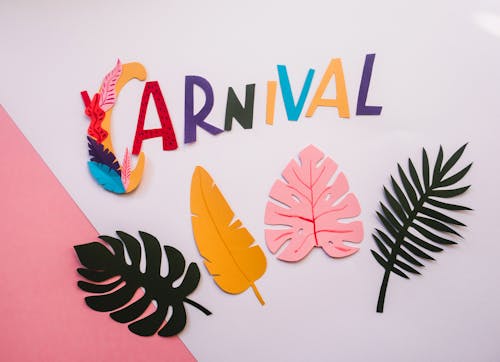 Photograph of Paper Leaves Under the Word Carnival