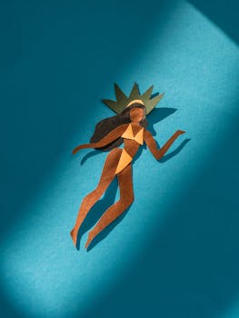 Vibrant paper cutout art inspired by Rio Carnival on a blue background.