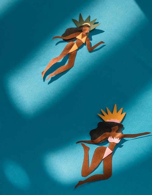 Brazilian Dancers Cut Out of Paper on Blue Background