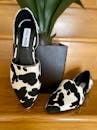 A Steve Madden Flats with Black and White Animal Print Design