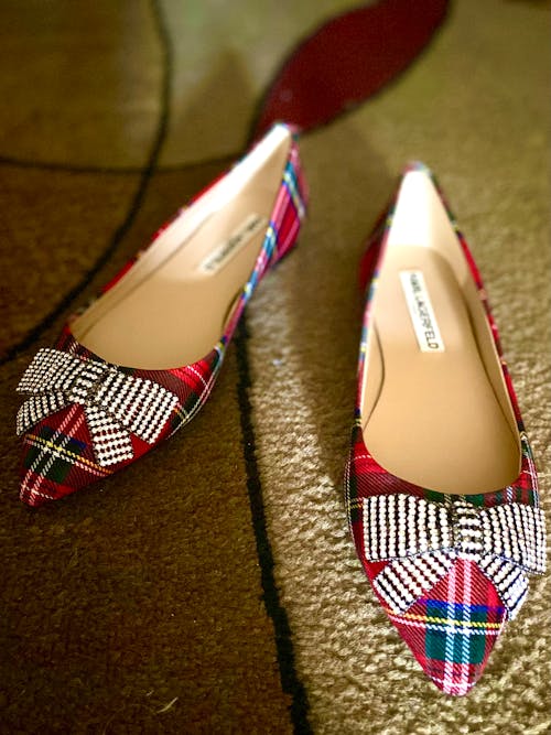 Free A Red Checkered Flat Shoes on the Ground Stock Photo