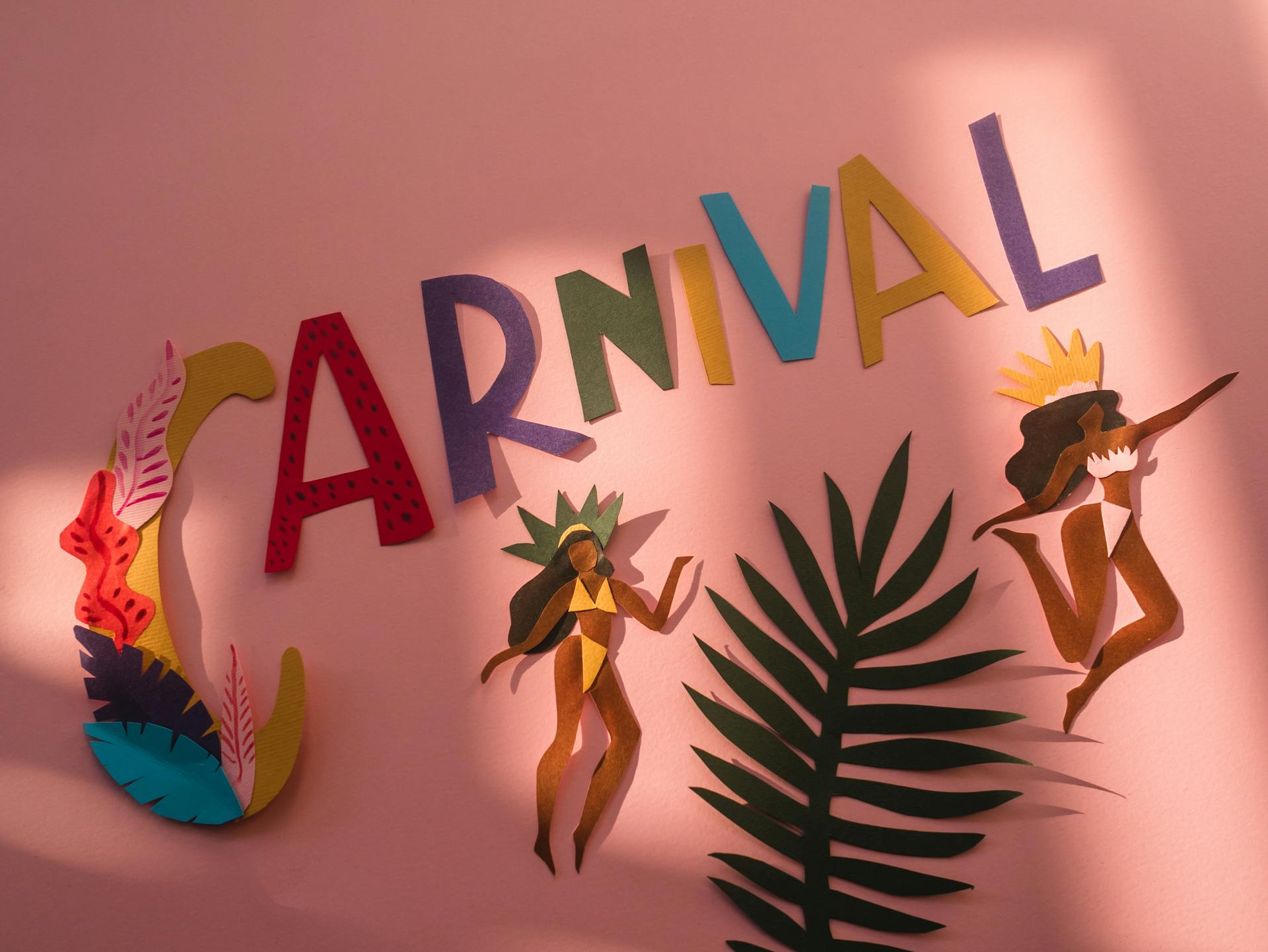 Vibrant paper cutout art depicting carnival dancers on a pink backdrop, evoking festive vibes.