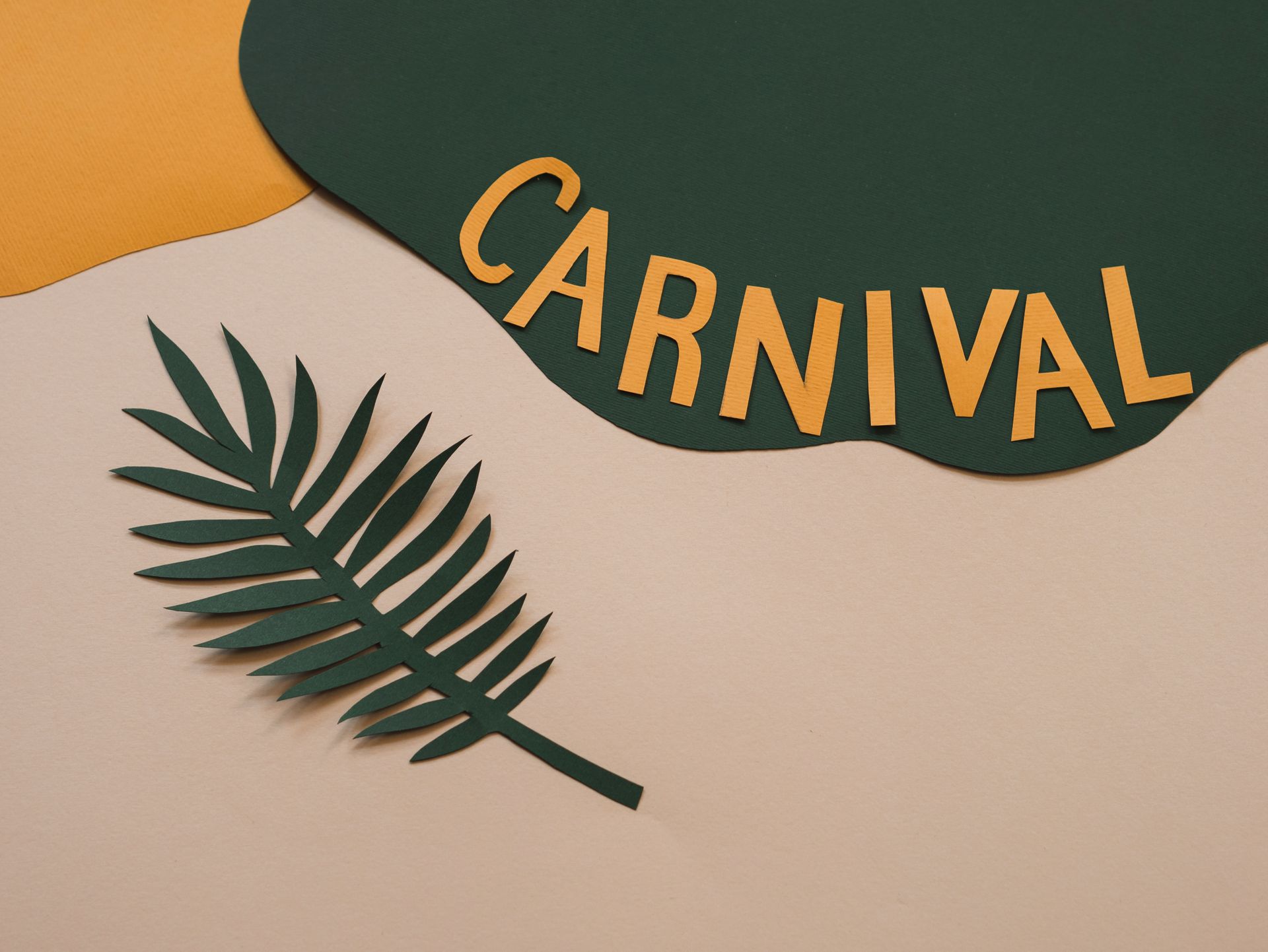 A vibrant paper art design featuring colorful carnival lettering and a palm leaf cutout.