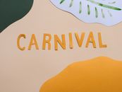 A vibrant carnival-themed decoration with cut-out paper letters on a pastel background.