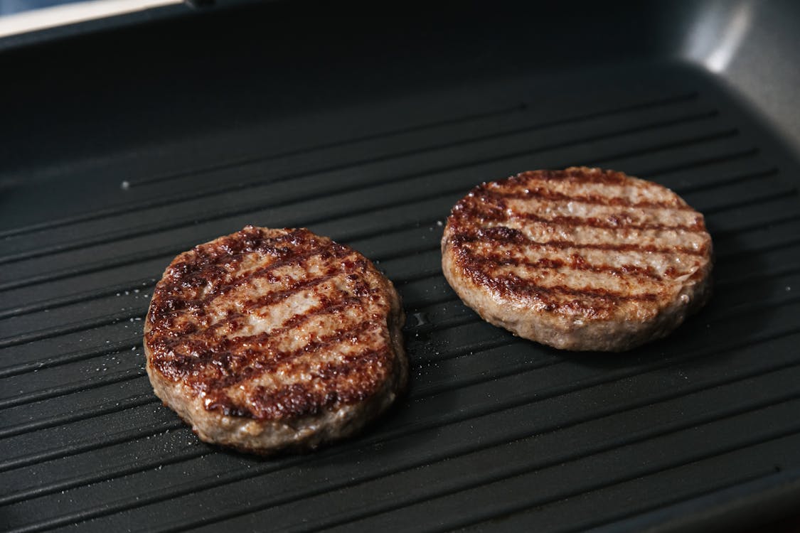 Free Photo of Beef Patties Being Grilled Stock Photo