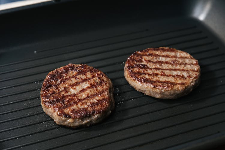 Photo Of Beef Patties Being Grilled