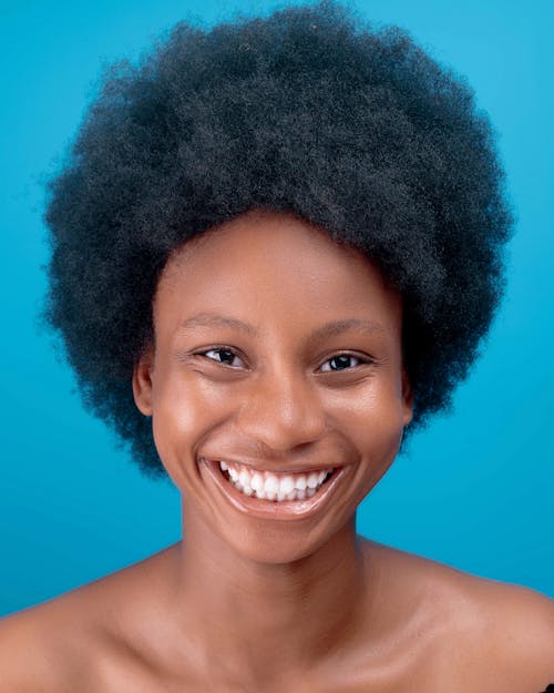 Free Smiling Woman With Black Curly Hair Stock Photo