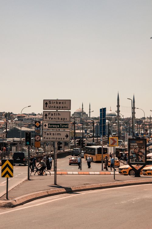 Free A busy street in Istanbul featuring road signs, traffic, and the cityscape in the background. Stock Photo