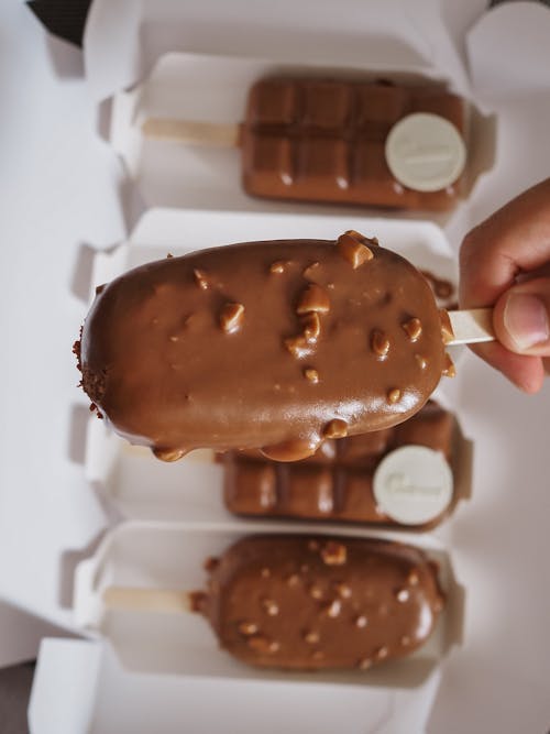Free Person Holding Chocolate Ice Cream Stock Photo