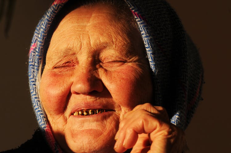 Woman Smiling With Gold Teeth