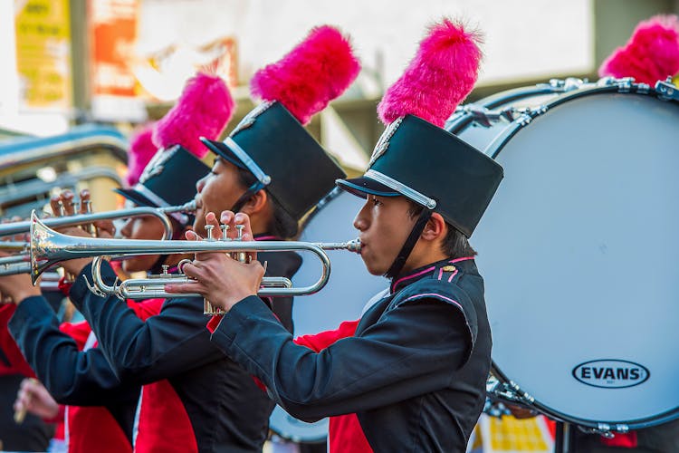 Boy In Marching Band Uniform Playing Trumpet