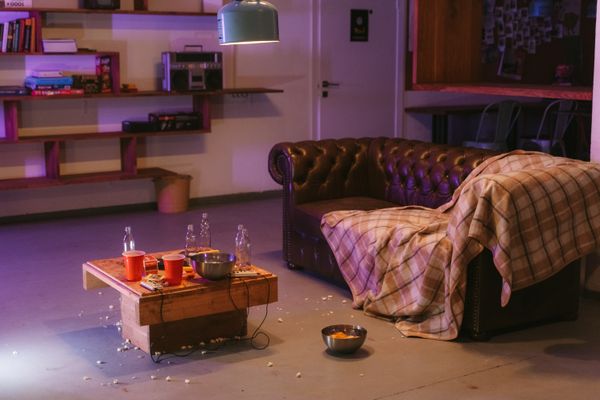 Living area before clean — cluttered and messy