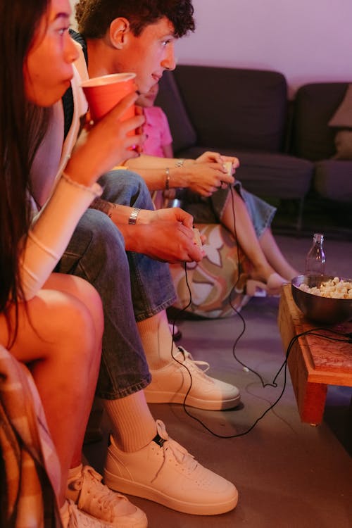 Friends Sitting and Playing Game