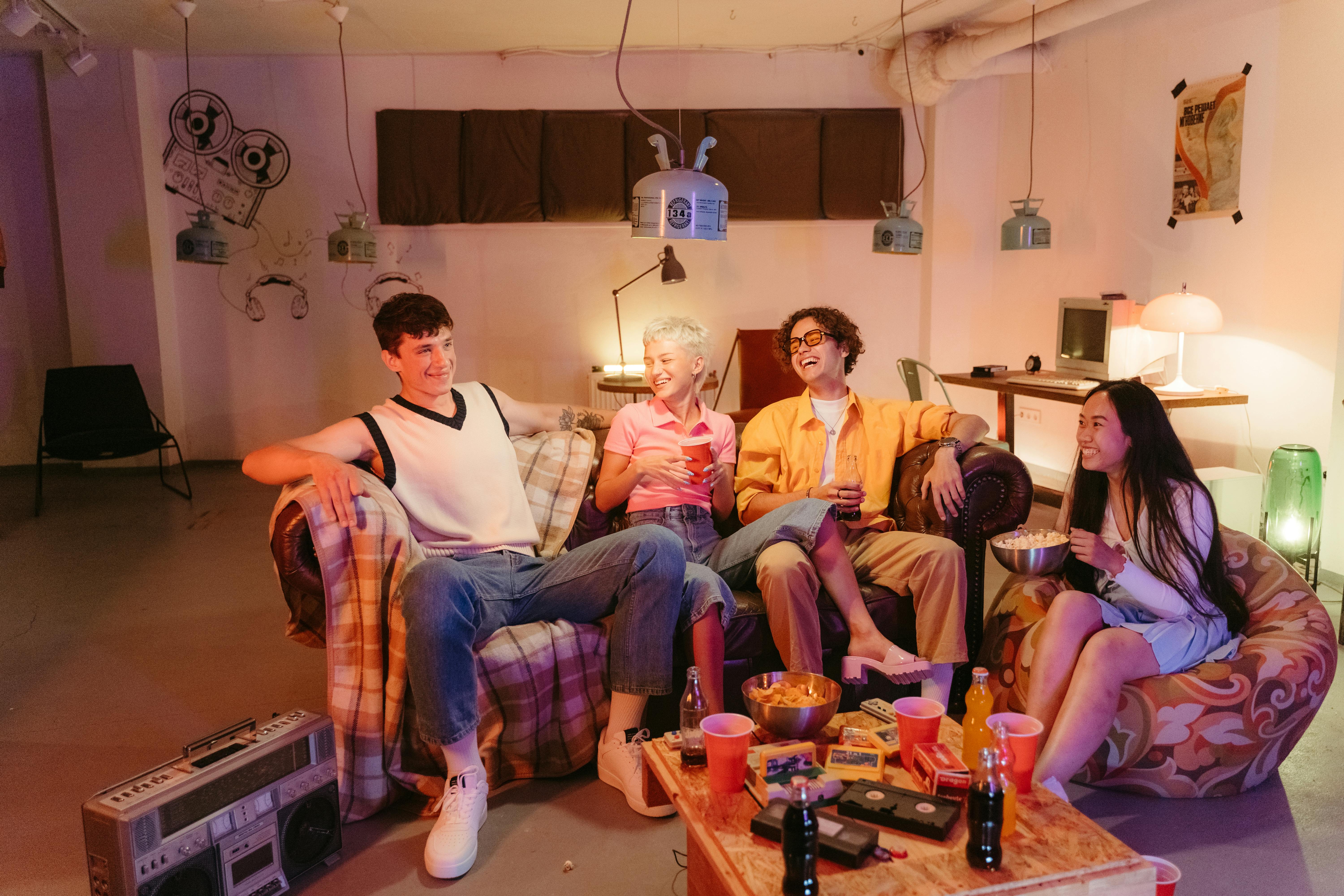 group of friends having a good conversation while sitting on a couch