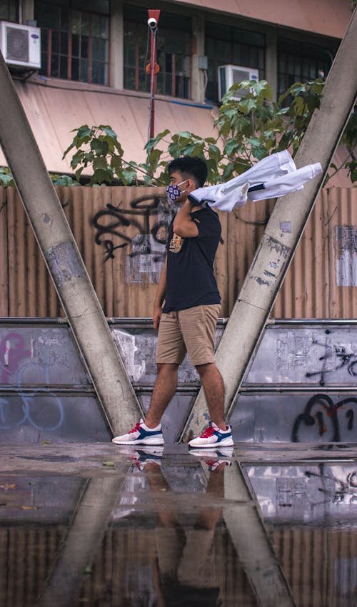 Man Holding a Jacket Posing