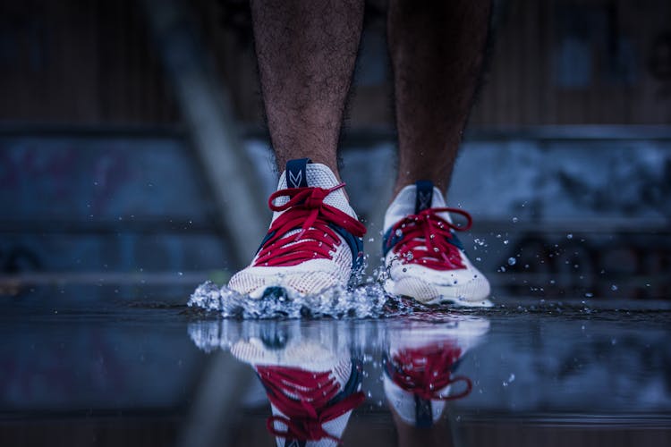 A Person Stepping On A Puddle 