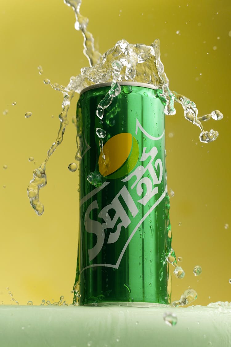 Photo Of A Green Can With Liquid Spilling Over