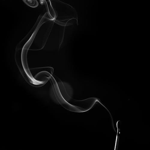 Grayscale Photo of a Match Stick with Smoke