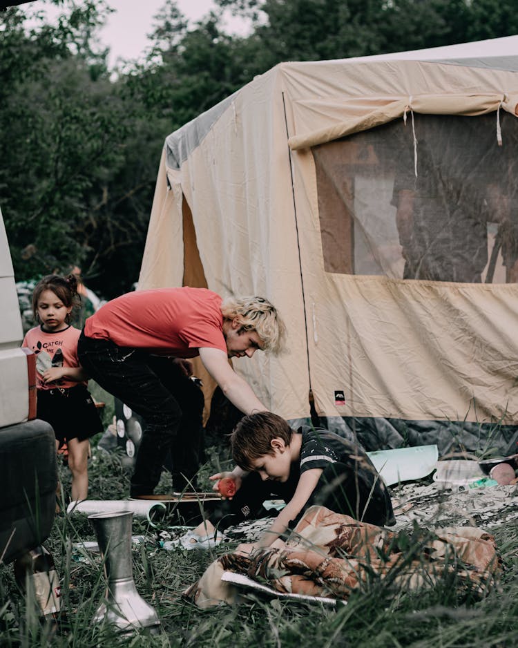 Father With Their Children Camping