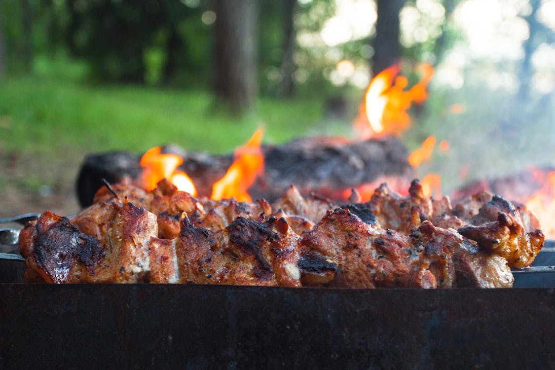 Free Cooking Pork in a Grill Stock Photo