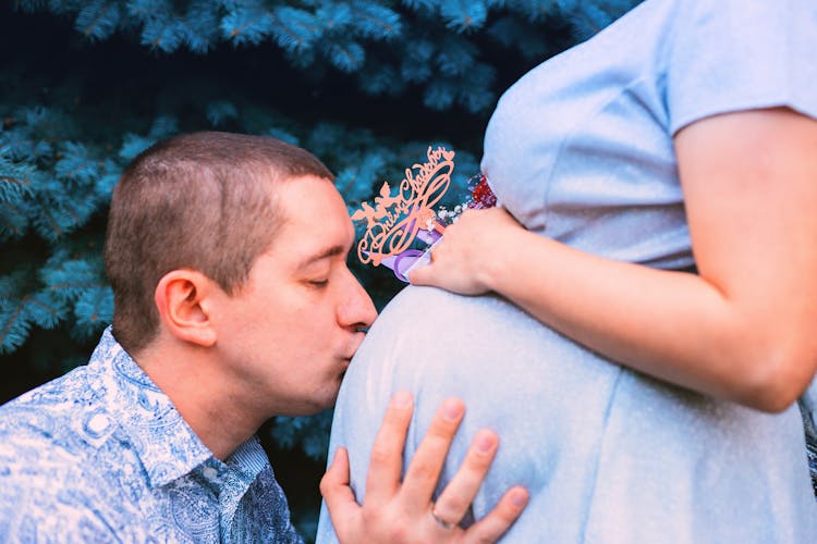 Man Kissing Pregnant Stomach