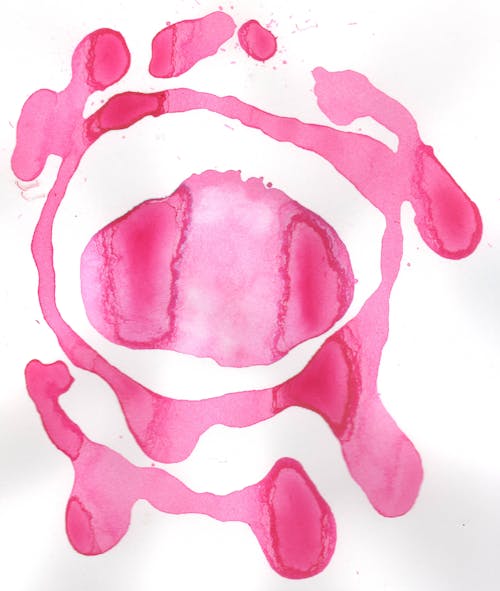 Photograph of Pink Paint on a White Surface