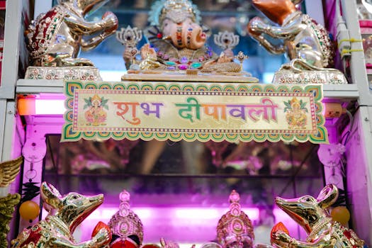 Colorful display of Diwali decorations featuring a Ganesh statue, vibrant lighting, and traditional Hindu elements.