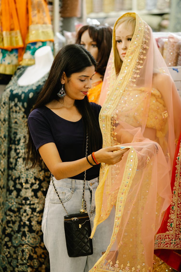 Photo Of A Woman Touching A Sheer Fabric