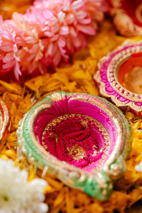 Free A Pink Flower Rangoli on Yellow Surface Stock Photo
