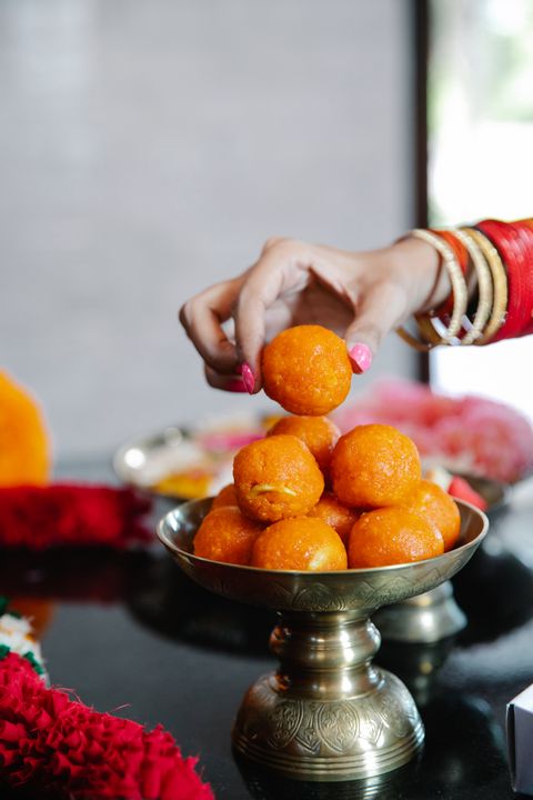 Homemade Mithai Without a Commercial Kitchen: 8 Traditional Indian Sweets You Can Make at Home 1 Close-up of pure desi ghee being poured into a heavy-bottomed pan for mithai making
