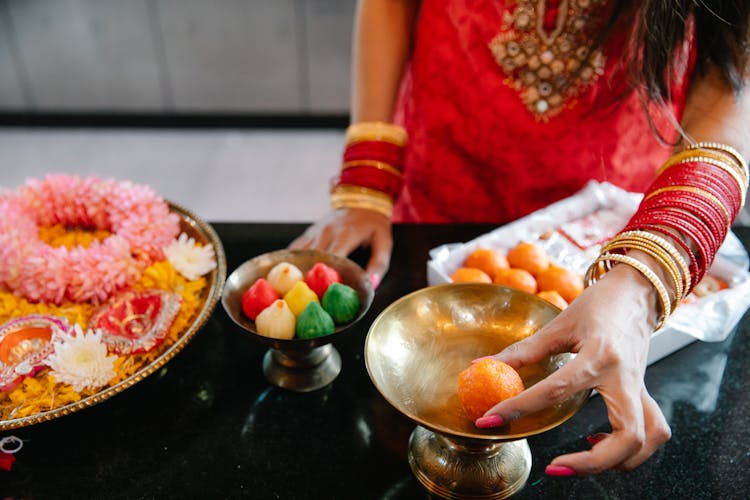 Close Up Of Woman Taking Food From Dish