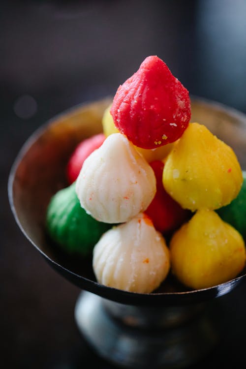 Close-up of Colourful Modak in a Bowl 