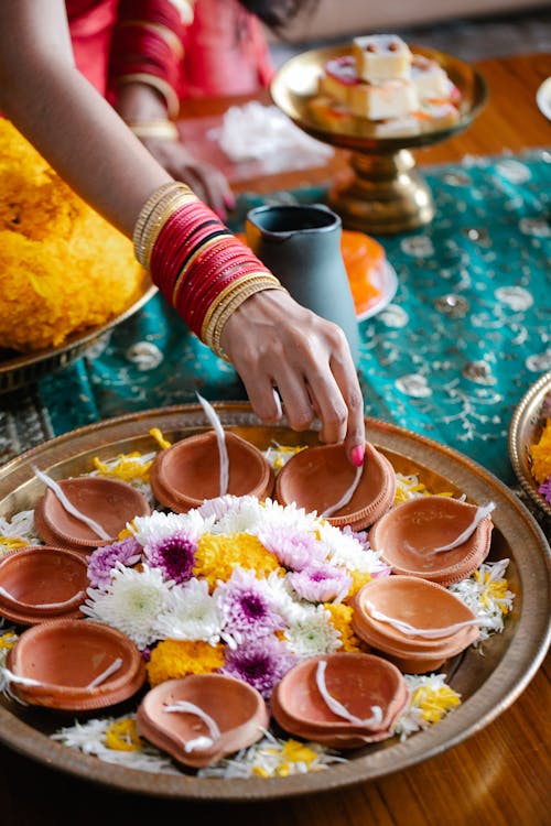 Women Setting Up a Table for Traditional Celebration 