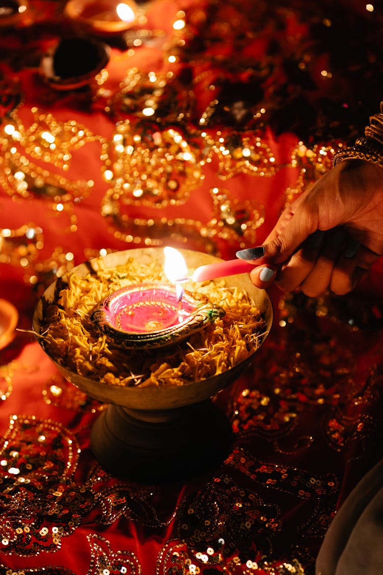 Close Up Of A Person Lighting A Candle