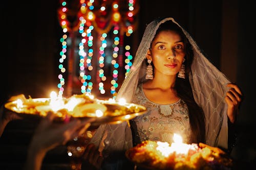 Woman in Traditional Clothes at Ceremony at Night