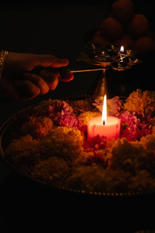 Close-up of Woman Lighting a Candles 