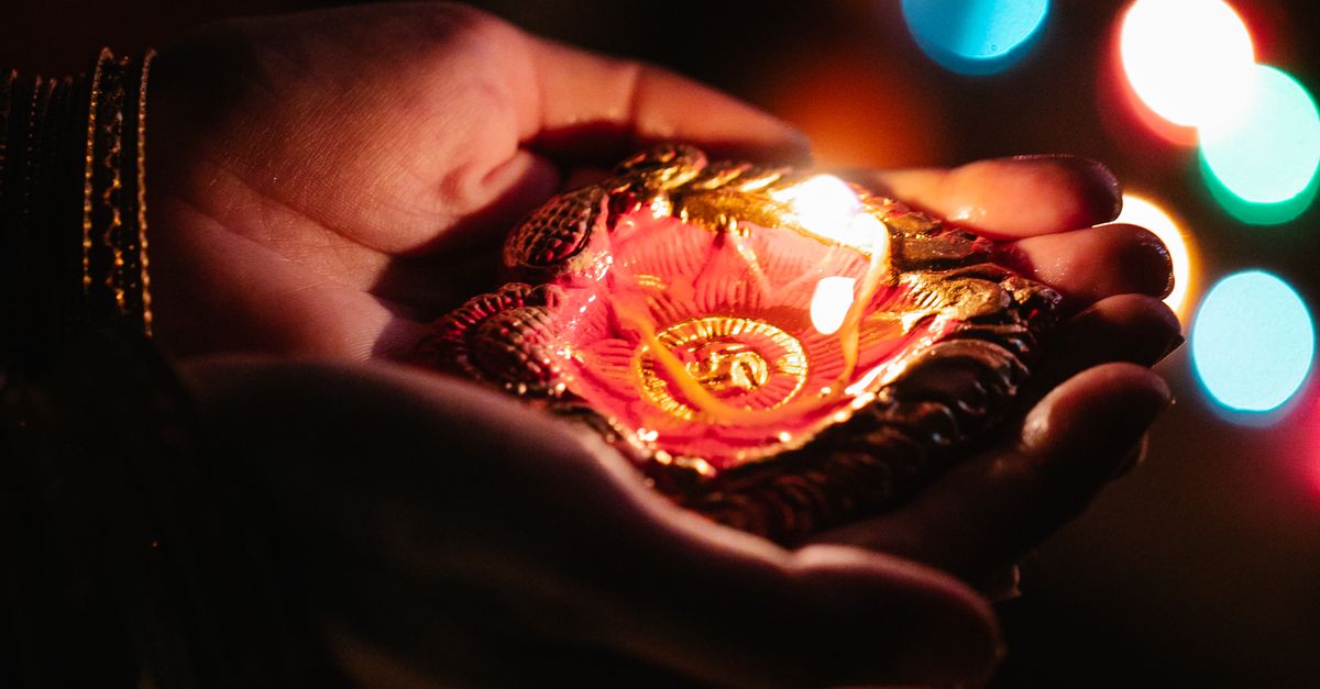 Hand Holding Wax Candle · Free Stock Photo