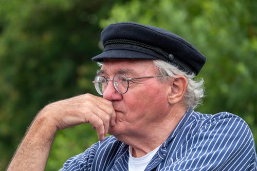 Elderly Man Wearing a Breton Cap Looking Afar