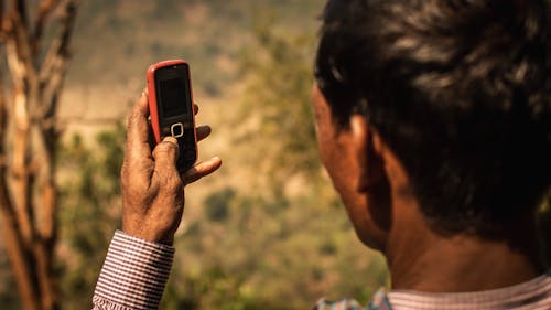 Person Holding a Mobile Phone