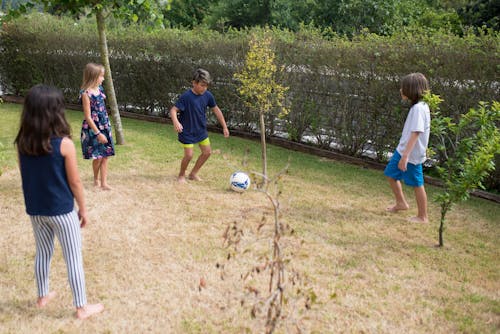 Group of kid Playing Football