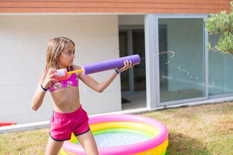 Girl Shooting A Water Gun