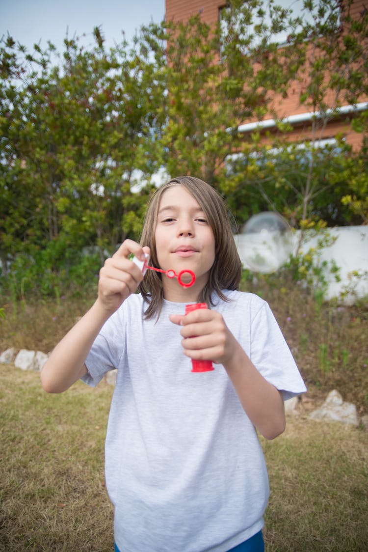 Boy Blowing Bubbles