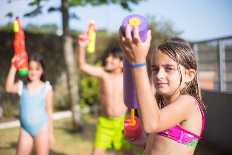 Cute Girl Holding A Water Gun