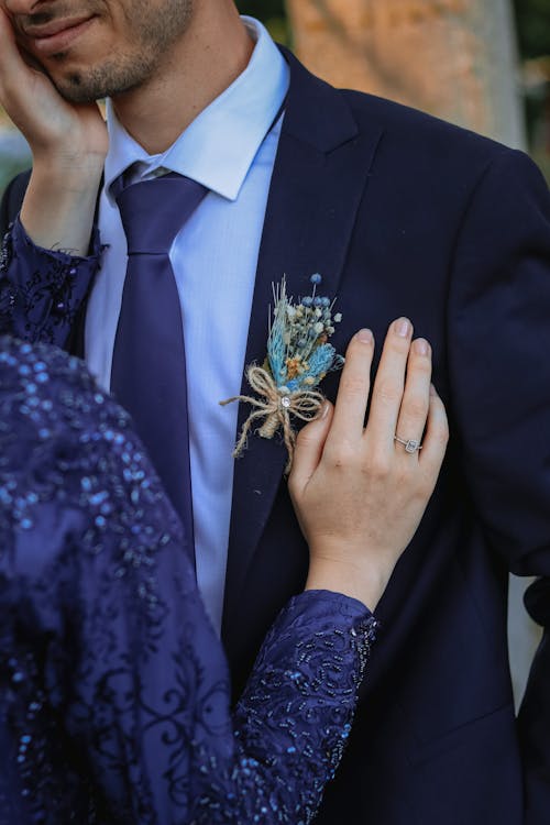 Free Man Wearing Suit with Boutonniere and Woman in Blue Gown Stock Photo